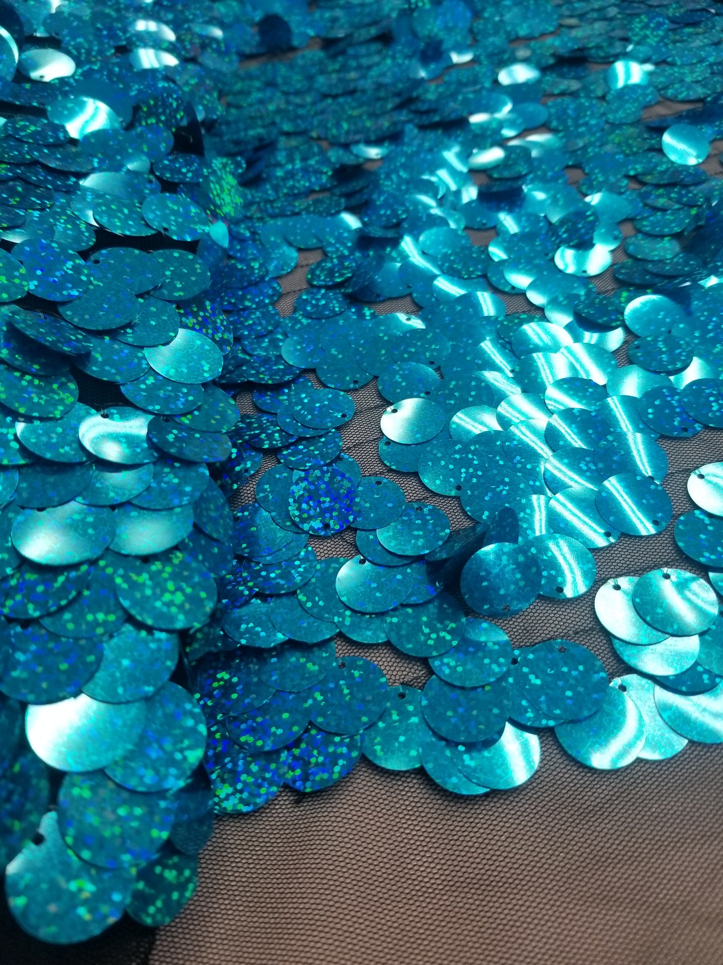 Turquoise Iridescent Jumbo Size Tear Drop Sequins on Stretch Mesh Base 2 Way Stretch 56/57" Sold by the Yard